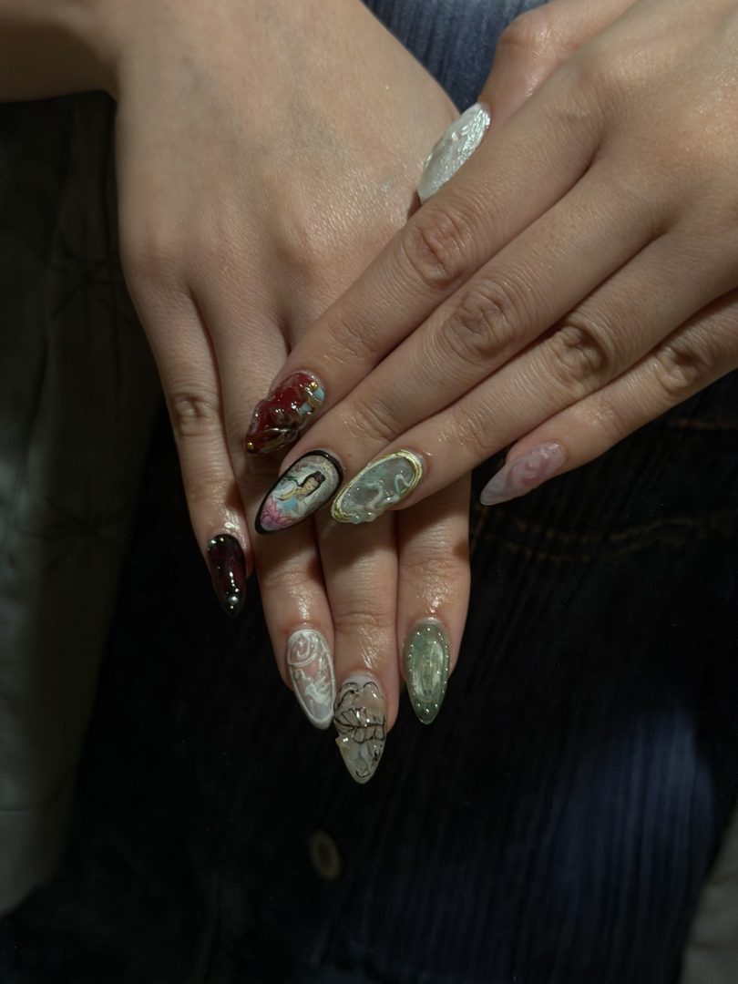 A hand-painted portrait with koi and jade accents